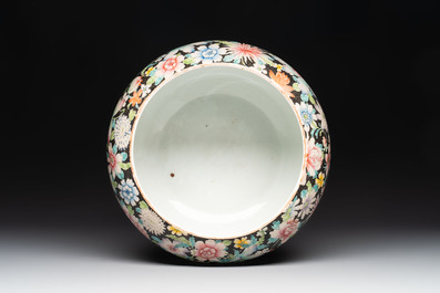 A Chinese famille rose 'millefleurs' water container, a covered bowl, a spoon and a famille noire vase mounted as lamp, Qianlong mark, 19/20th C.