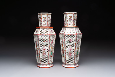 A pair of Chinese famille rose reticulated double-walled 'mandarin subject' vases, Qianlong
