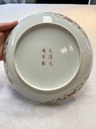 A Chinese famille rose yellow-ground 'dragon' plate and a 'lantern festival' plate, Guangxu marks and of the period