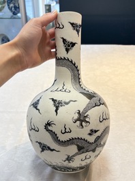 A Chinese black-enamelled  biscuit 'dragon' vase, Qianlong mark, 19th C.