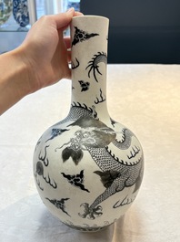 A Chinese black-enamelled  biscuit 'dragon' vase, Qianlong mark, 19th C.