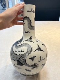 A Chinese black-enamelled  biscuit 'dragon' vase, Qianlong mark, 19th C.