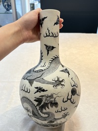 A Chinese black-enamelled  biscuit 'dragon' vase, Qianlong mark, 19th C.