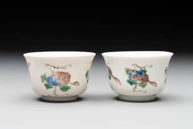 A pair of Chinese famille verte 'squirrels and melons' cups, Chenghua mark, Kangxi