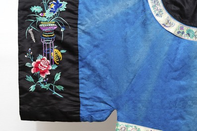 A rare Chinese blue-ground embroidered silk 'butterflies and flowers' robe, lined with fur, 19th C.