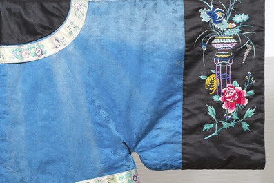 A rare Chinese blue-ground embroidered silk 'butterflies and flowers' robe, lined with fur, 19th C.