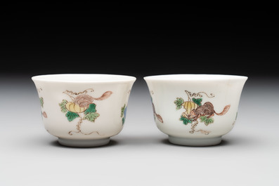 A pair of Chinese famille verte 'squirrels and melons' cups, Chenghua mark, Kangxi