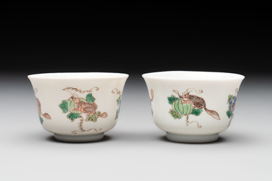 A pair of Chinese famille verte 'squirrels and melons' cups, Chenghua mark, Kangxi