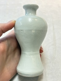 A pair of Chinese white-glazed vases and a pair of blue and white covered jars, Wanli mark and of the period