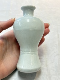 A pair of Chinese white-glazed vases and a pair of blue and white covered jars, Wanli mark and of the period