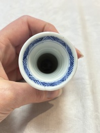 Four Chinese blue and white miniature vases, one with cover, Kangxi