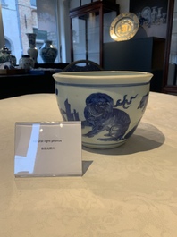 A Chinese blue and white 'Buddhist lion and elephant' scroll jar or jardini&egrave;re, Transitional period