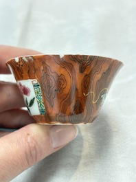 A Chinese famille rose blue-ground cup and saucer, and a 'faux-bois' cup and saucer, Yongzheng/Qianlong