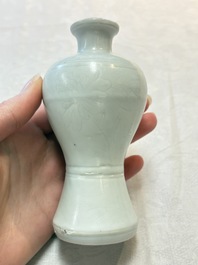 A pair of Chinese white-glazed vases and a pair of blue and white covered jars, Wanli mark and of the period