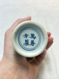 A pair of Chinese white-glazed vases and a pair of blue and white covered jars, Wanli mark and of the period