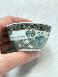 A fine Chinese famille rose 'apple pickers' cup and saucer, Yongzheng