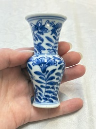 Four Chinese blue and white miniature vases, one with cover, Kangxi