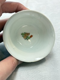 A Chinese famille rose blue-ground cup and saucer, and a 'faux-bois' cup and saucer, Yongzheng/Qianlong