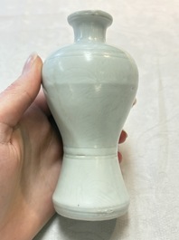 A pair of Chinese white-glazed vases and a pair of blue and white covered jars, Wanli mark and of the period