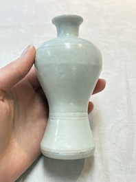 A pair of Chinese white-glazed vases and a pair of blue and white covered jars, Wanli mark and of the period