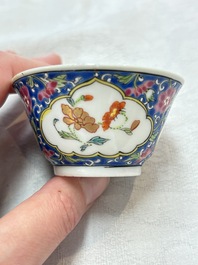 A Chinese famille rose blue-ground cup and saucer, and a 'faux-bois' cup and saucer, Yongzheng/Qianlong