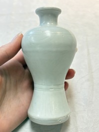 A pair of Chinese white-glazed vases and a pair of blue and white covered jars, Wanli mark and of the period