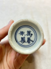 A pair of Chinese white-glazed vases and a pair of blue and white covered jars, Wanli mark and of the period