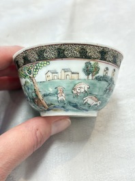 A fine Chinese famille rose 'apple pickers' cup and saucer, Yongzheng