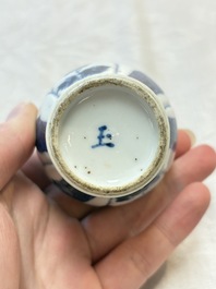 Four Chinese blue and white miniature vases, one with cover, Kangxi