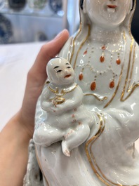 A Chinese gilt- and iron-red-decorated white-glazed figure of Guanyin, Cai Yongxin 蔡永新造 mark, 20th C.