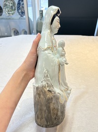 A Chinese gilt- and iron-red-decorated white-glazed figure of Guanyin, Cai Yongxin 蔡永新造 mark, 20th C.