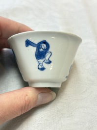 Five Chinese blue and white 'elegant beauty and boy' cups and saucers, Chenghua mark, Kangxi