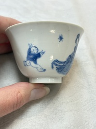Five Chinese blue and white 'elegant beauty and boy' cups and saucers, Chenghua mark, Kangxi