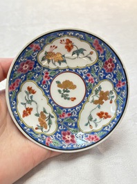 A Chinese famille rose blue-ground cup and saucer, and a 'faux-bois' cup and saucer, Yongzheng/Qianlong