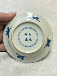 Five Chinese blue and white 'elegant beauty and boy' cups and saucers, Chenghua mark, Kangxi