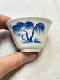 Five Chinese blue and white 'elegant beauty and boy' cups and saucers, Chenghua mark, Kangxi