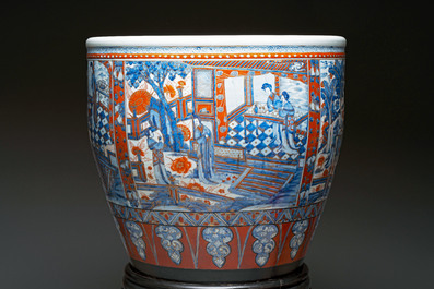 A large Chinese European-decorated blue and white fish bowl with narrative design, on a later wooden stand, Kangxi