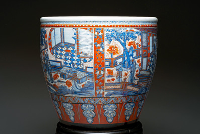 A large Chinese European-decorated blue and white fish bowl with narrative design, on a later wooden stand, Kangxi