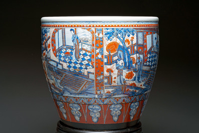 A large Chinese European-decorated blue and white fish bowl with narrative design, on a later wooden stand, Kangxi
