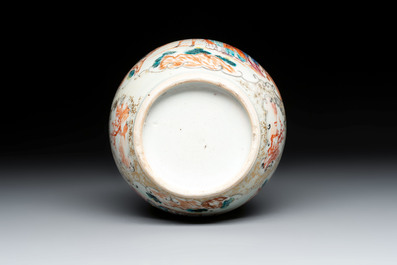 A pair of Chinese Canton famille rose 'mandarin subject' covered tureens and stands and a vase, Qianlong