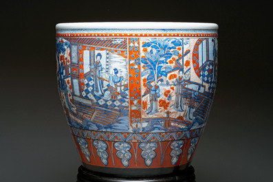 A large Chinese European-decorated blue and white fish bowl with narrative design, on a later wooden stand, Kangxi