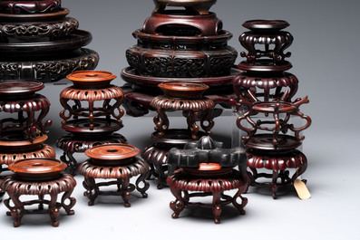 A collection of 45 Chinese wooden stands, 19/20th C.