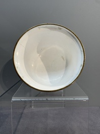 A Chinese Canton enamel 'foreigners' bowl and cover and an 'erotical subject' plate, Yongzheng/Qianlong
