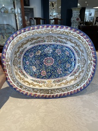 A large Chinese Canton enamel basin with garlands decorated with male heads, Qianlong