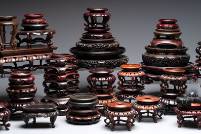 A collection of 45 Chinese wooden stands, 19/20th C.