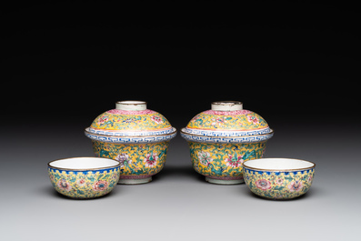 A pair of Chinese yellow-ground Canton enamel covered bowls and two cups, Yongzheng/Qianlong