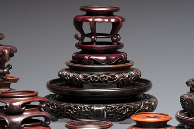 A collection of 45 Chinese wooden stands, 19/20th C.