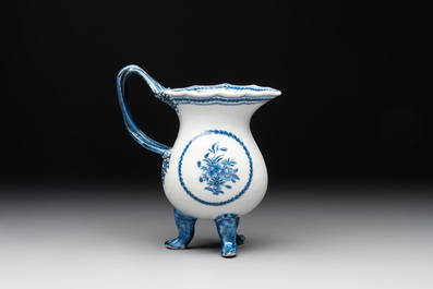A pair of Chinese blue and white handled cups and saucers and a milk jug, Qianlong/Jiaqing