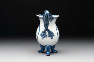 A pair of Chinese blue and white handled cups and saucers and a milk jug, Qianlong/Jiaqing