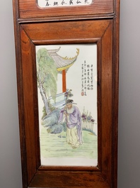A Chinese carved wooden panel with famille rose plaques in the style of Wang Qi 王琦, dated 1932